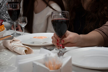 Family feast in the restaurant. Holidays and memorable events. A group of people at the table.