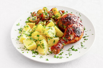 Roasted chicken leg with boiled potato