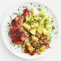 Roasted chicken leg with boiled potato