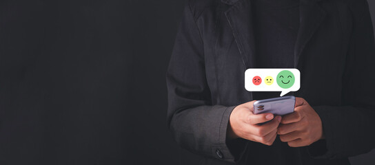 Satisfaction survey and customer service concept. Hand touching satisfaction on smartphone and give...