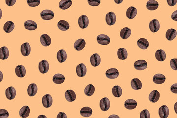 Chaotic pattern of aromatic coffee beans on a mocha background