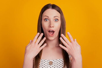 Portrait of astonished shocked funky lady open mouth on yellow background