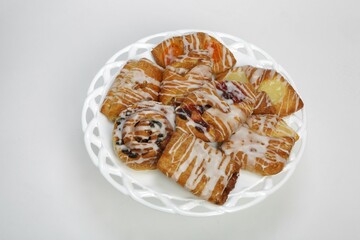 Closeup of plate of Danish rolls pastries