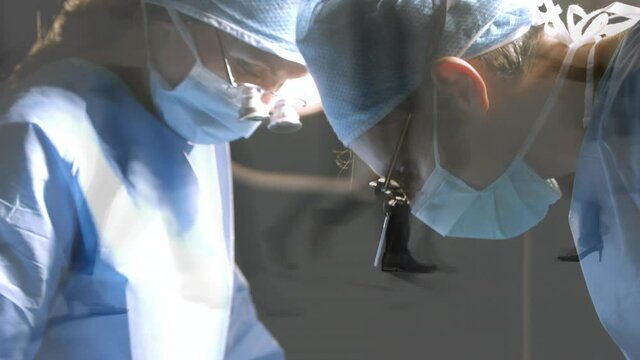 Male and female surgeons wearing binoculars performing surgery against time-lapse of people walking