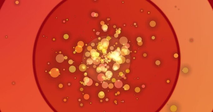 Animation of yellow and orange bokeh circles of light floating on red and orange circles