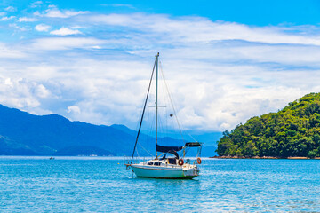 Boats ships and Boat trips Abraao beach Ilha Grande Brazil.