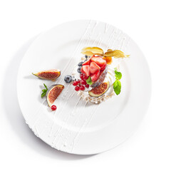 Pavlova dessert in white plate