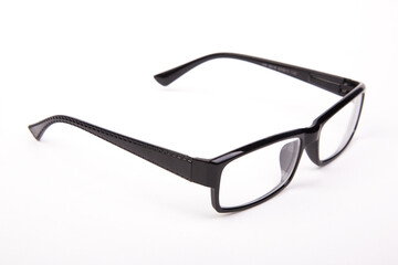 Stylish glasses with black frames on a white background