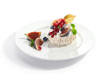 Pavlova dessert in white plate