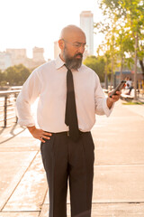 Asian businessman talking on the phone in an urban environment