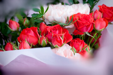 gift bouquet with red roses and pink carnations