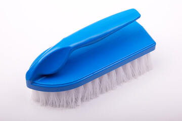 blue surface cleaning brush on a white background