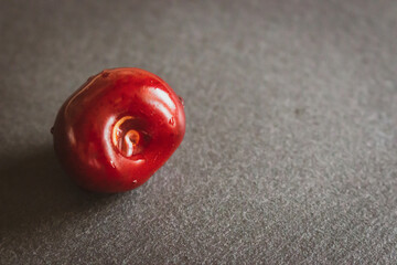 Ripe cherry fruit on dark board. Juicy cherry on the table. Cherry fruits. Summer harvest concept. Fresh fruits. Vitamin and refreshment concept. Healthy raw dessert. Sweet diet. 