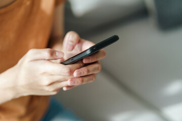 Young Asian woman using smartphone typing, chatting conversation . Social Network, technology concept