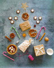 Creative edible Christmas tree made of dried oranges, cookies, lollipops cane,  flat lay copy space