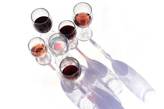 Wine Of Different Varieties In Glasses On A White Background.