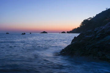 Fototapeta na wymiar sunset over the sea with low speed