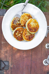 syrniki sweet pancakes cottage cheese breakfast outdoor meal snack on the table copy space food background rustic top view 
