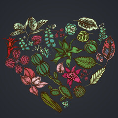 Heart floral design on dark background with ficus, iresine, kalanchoe, calathea, guzmania, cactus
