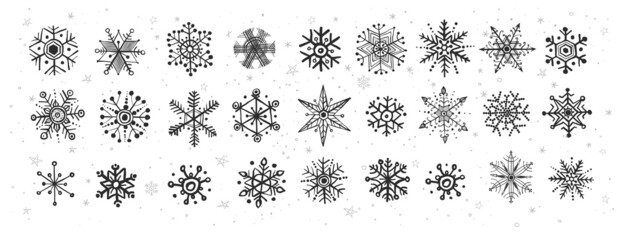 Collection of doodle snowflakes on white background.