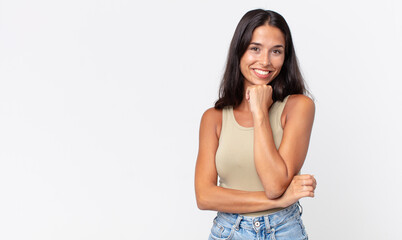 pretty thin hispanic woman looking happy, wondering or asking a question
