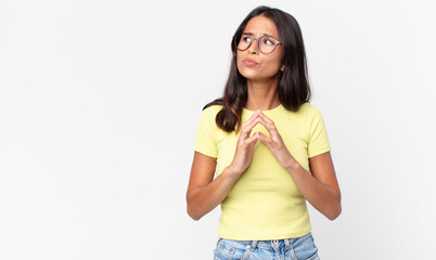 pretty thin hispanic woman scheming and conspiring