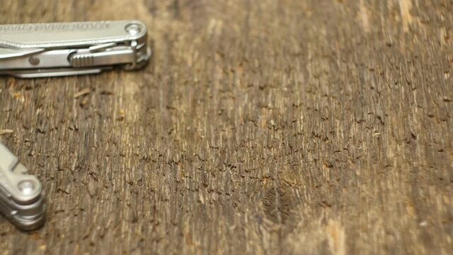 multitool stainless steel with pliers close-up camera in motion