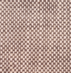 Textured fabric in contrasting shades of brown and cream with copyspace