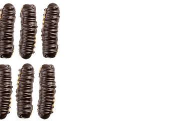 Dessert Bomba de Chocolate. Brazilian traditional éclair on a white background.  Selective focus. Top view.