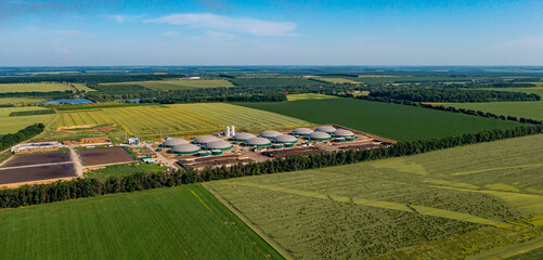 Biogas complex, view of storage tanks, energy production plant, view from height. Modern bio gas station or factory building. Bio gas plant. Sustainable production. Ecological production