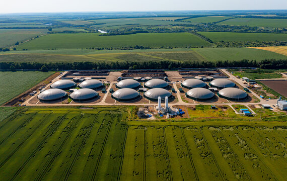 Production of sustainable fuel called bio gas. New factory in field. View from above. Ecological production concept