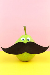 Cute pear with mustache. Minimal concept background cover image wallpaper