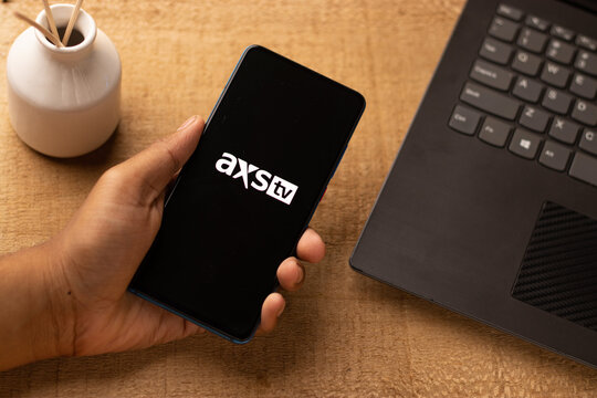 Assam, india - June 21, 2021 : AXS TV logo on phone screen stock image.