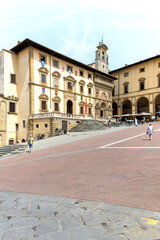 Fototapeta na wymiar Piazza Grande the main square of tuscan Arezzo city, Italy - View at the Palace of Fraternita of Laici and the Logge Vasari