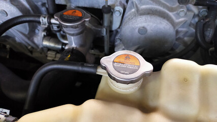 Car engine radiator cap close-up - 450368358