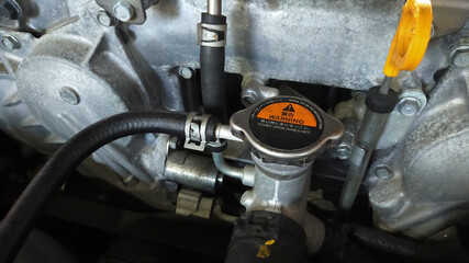 Car engine radiator cap close-up - 450368743