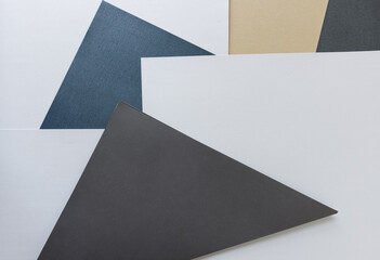gray, blue, and sand paper corners with white space