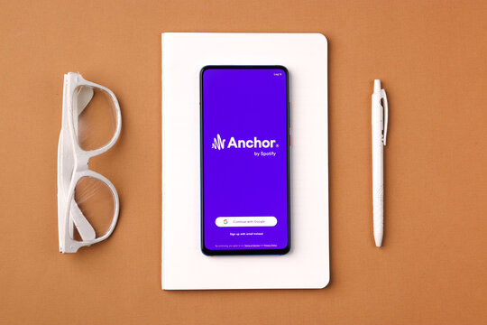 Assam, india - March 10, 2021 : Anchor logo on phone screen stock image.