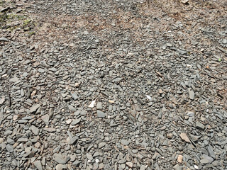 From above background of lots of stones on shore of river