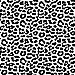 Seamless black and white leopard spots background pattern