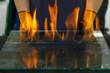 Burning glass, Laminated VSG material, Cut in a glass workshop. A specialist burns through the foil...