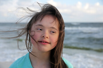 Portrait of the girl smiling on background of the sea