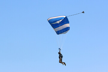 	
Skydiver in a blue sky