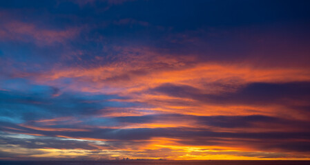 Obraz premium Scene of Sunset close up the sun. Colorful romantic sky sunset with Moving clouds background. time lapse day to night in nature and travel concept.