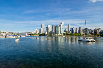 Naklejka premium sailboats of False Creek with Vancouver, Canada city skyline in the distance