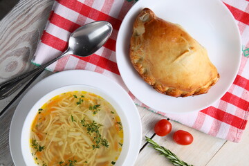 A bowl of healthy chicken noodle soup