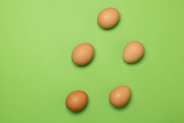 Happy Easter. Collection of random pattern eggs on green background.