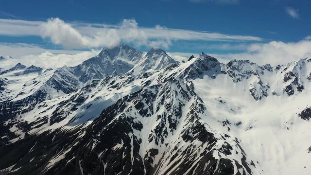 Aerial View from an drone of Beautiful Snowy Caucasus Mountain Landscape in Winter.Flight above Snowcapped mountains