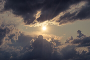 Sky with sun rays through the clouds