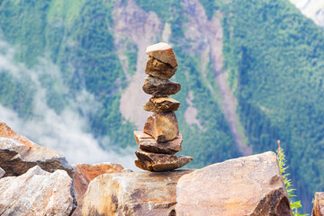 Balanced stones against the background of mountains, Balance and tranquility